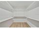 Large walk-in closet with installed shelving and plenty of storage space at 19003 Cedar Ln, Lutz, FL 33548