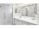 Bathroom showcasing a shower and vanity area with large mirror and ample cabinet space at 1901 E Del Webb Blvd, Sun City Center, FL 33573