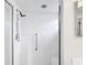 Bathroom showing a walk-in shower with a shower head and grab bar at 1901 E Del Webb Blvd, Sun City Center, FL 33573
