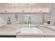 Bright kitchen featuring white cabinetry, laminate countertops, and a double-basin sink at 1901 E Del Webb Blvd, Sun City Center, FL 33573