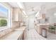 Spacious kitchen with white cabinets, white appliances, ample counter space, and a breakfast nook at 1901 E Del Webb Blvd, Sun City Center, FL 33573