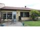 Backyard patio with seating and potted plants at 2101 Sunset Point Rd # 2304, Clearwater, FL 33765