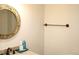 Bathroom with decorative mirror above granite vanity at 2101 Sunset Point Rd # 2304, Clearwater, FL 33765