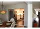 Bright kitchen features stainless steel appliances, white cabinetry, and seamless view to the dining area at 2101 Sunset Point Rd # 2304, Clearwater, FL 33765