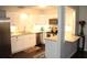 Modern kitchen with white cabinets, stainless steel appliances, and granite countertops at 2101 Sunset Point Rd # 2304, Clearwater, FL 33765