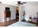 Inviting living room with hardwood floors, neutral walls, and ample natural light at 2101 Sunset Point Rd # 2304, Clearwater, FL 33765