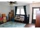 Cozy living room with wood floors, a plush rug, and natural light streaming through the windows at 2101 Sunset Point Rd # 2304, Clearwater, FL 33765
