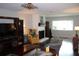 Cozy living room with hardwood floors, fireplace, and comfortable seating at 2101 Sunset Point Rd # 2304, Clearwater, FL 33765