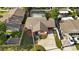 Charming home featuring a backyard pool and covered patio, complete with a well-maintained lawn and cozy curb appeal at 2233 Curlew Rd, Dunedin, FL 34698