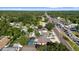 An aerial view showcasing the neighborhood, with lush greenery and convenient access to the main street and surrounding amenities at 2233 Curlew Rd, Dunedin, FL 34698