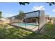 Backyard view of pool and lanai at 2233 Curlew Rd, Dunedin, FL 34698