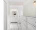 Bathroom featuring tiled floors and a white vanity with a mirror and storage at 2233 Curlew Rd, Dunedin, FL 34698