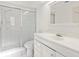 Bathroom featuring a glass shower and a white vanity with sink at 2233 Curlew Rd, Dunedin, FL 34698