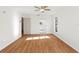 Bright bedroom with hardwood floors and a ceiling fan at 2233 Curlew Rd, Dunedin, FL 34698