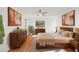 Bedroom with hardwood floors, a large bed, and stylish furnishings at 2233 Curlew Rd, Dunedin, FL 34698