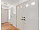 Bright foyer features a closet and hardwood floors, creating an inviting entrance at 2233 Curlew Rd, Dunedin, FL 34698