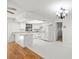 Bright, all white kitchen with lots of cabinet space and granite countertops at 2233 Curlew Rd, Dunedin, FL 34698