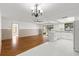 Spacious living area featuring a combined kitchen, hardwood floors and sliding doors at 2233 Curlew Rd, Dunedin, FL 34698