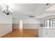 Open-concept living space with hardwood floors, access to the outdoors, and ample natural light at 2233 Curlew Rd, Dunedin, FL 34698