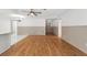 Large open living room with hardwood floors leads to kitchen and dining areas, and front entrance at 2233 Curlew Rd, Dunedin, FL 34698