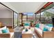 Outdoor patio with comfortable wicker furniture and view of the pool at 2233 Curlew Rd, Dunedin, FL 34698