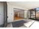 Covered patio with sliding glass doors to indoor living room at 2233 Curlew Rd, Dunedin, FL 34698