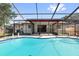Private, screened pool and patio area offers the perfect outdoor oasis at 2233 Curlew Rd, Dunedin, FL 34698