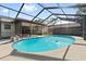Enjoy the backyard and private pool, screened-in for year-round enjoyment at 2233 Curlew Rd, Dunedin, FL 34698