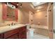 Well-lit bathroom with a tiled shower and a vanity, offering a clean and functional space at 2308 Long Green Ct, Valrico, FL 33596