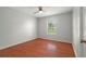 Bedroom featuring hardwood floors and natural light, creating a serene and inviting space at 2308 Long Green Ct, Valrico, FL 33596