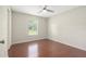 Cozy bedroom with hardwood floors and natural light, creating a serene and inviting space at 2308 Long Green Ct, Valrico, FL 33596