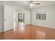 Bedroom featuring hardwood floors, double doors, and ample natural light, offering comfort and style at 2308 Long Green Ct, Valrico, FL 33596