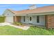 Inviting single-story home featuring a well-manicured lawn, garage, and covered front entry at 2308 Long Green Ct, Valrico, FL 33596
