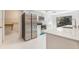 Modern kitchen featuring stainless steel appliances, quartz countertops, and ample cabinet space at 2308 Long Green Ct, Valrico, FL 33596