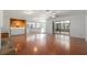 Spacious living room featuring hardwood floors, modern lighting, and a seamless flow to the patio at 2308 Long Green Ct, Valrico, FL 33596
