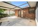 Covered patio with brick accents, offers a great outdoor living space for entertaining at 2308 Long Green Ct, Valrico, FL 33596