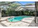 Pool with screened enclosure surrounded by landscaping and view of the sky at 2308 Long Green Ct, Valrico, FL 33596