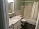 Bathroom featuring a marble vanity top, tiled backsplash, and combination tub and shower at 2410 Franciscan Dr # 18, Clearwater, FL 33763