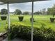 Scenic view from the patio of a lush green golf course under a cloudy sky at 2410 Franciscan Dr # 18, Clearwater, FL 33763