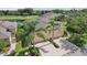 Inviting home with a two-car garage, mature palms, and a scenic pond view in a well-maintained neighborhood at 2427 Nottingham Greens Dr, Sun City Center, FL 33573