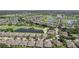 Beautiful aerial view of a residential community with a lake and golf course at 2427 Nottingham Greens Dr, Sun City Center, FL 33573