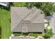 Aerial shot of the house roof with green surroundings at 2427 Nottingham Greens Dr, Sun City Center, FL 33573