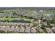 Breathtaking community aerial view of homes, serene lakes, and golf course amidst lush landscaping and beautiful scenery at 2427 Nottingham Greens Dr, Sun City Center, FL 33573