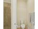 Neutral bathroom with enclosed shower and updated toilet at 2427 Nottingham Greens Dr, Sun City Center, FL 33573