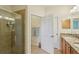 Bright bathroom with glass shower and granite counters at 2427 Nottingham Greens Dr, Sun City Center, FL 33573