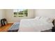 Cozy bedroom with a view of the lake at 2427 Nottingham Greens Dr, Sun City Center, FL 33573