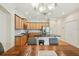 Open kitchen with island, stainless appliances, and eat in dining space at 2427 Nottingham Greens Dr, Sun City Center, FL 33573