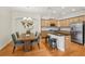 Stylish kitchen and dining area featuring modern appliances, granite countertops, and ample seating for Gathering meals at 2427 Nottingham Greens Dr, Sun City Center, FL 33573