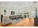 Bright, spacious living room featuring a large sectional sofa, stylish decor, and a lovely view at 2427 Nottingham Greens Dr, Sun City Center, FL 33573
