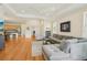 Open-concept living room flows seamlessly into a modern kitchen and dining area, perfect for entertaining at 2427 Nottingham Greens Dr, Sun City Center, FL 33573